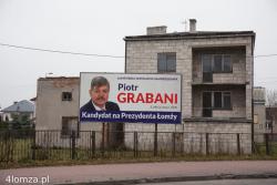 Łomża nasz wspólny dom - baner promocyjny kandydata na prezydenta Łomży Piotra Grabaniego.
